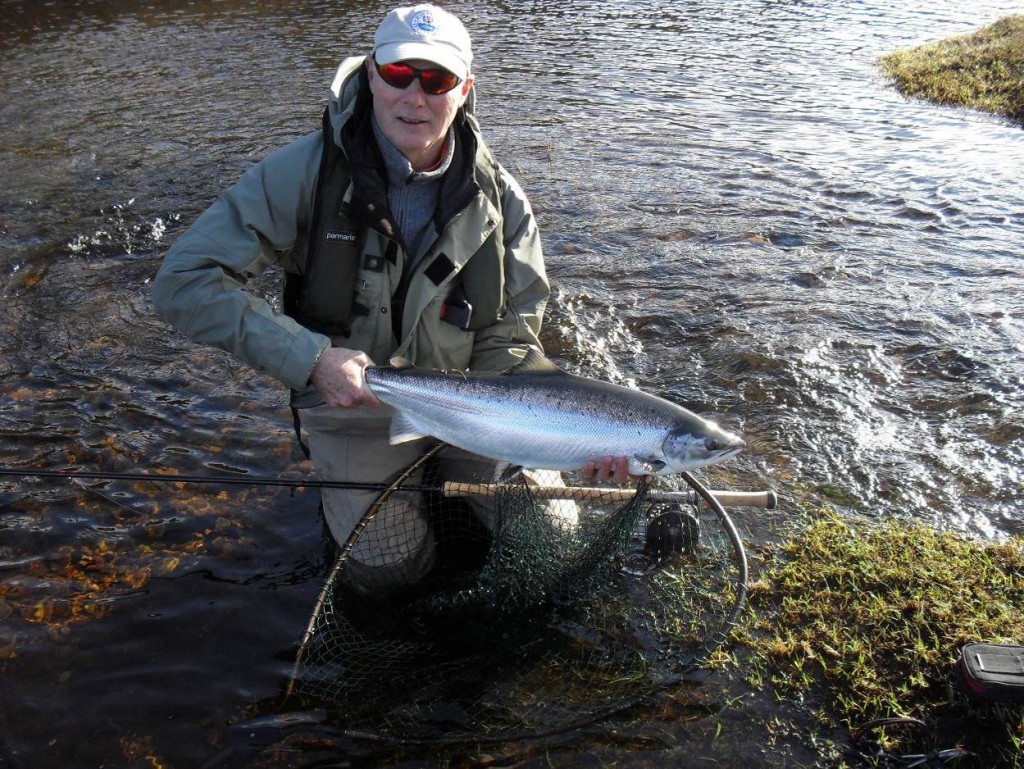 Angler Michael Martin with a Fresh run 'spring' salmon from the Ness system